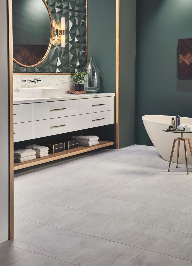 luxury vinyl tile flooring in an elegant green bathroom