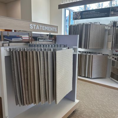 Statement carpet display at Weaver's Flooring America with neutral beige colors
