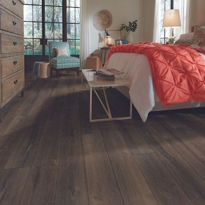 luxury vinyl plank flooring in a cozy bedroom